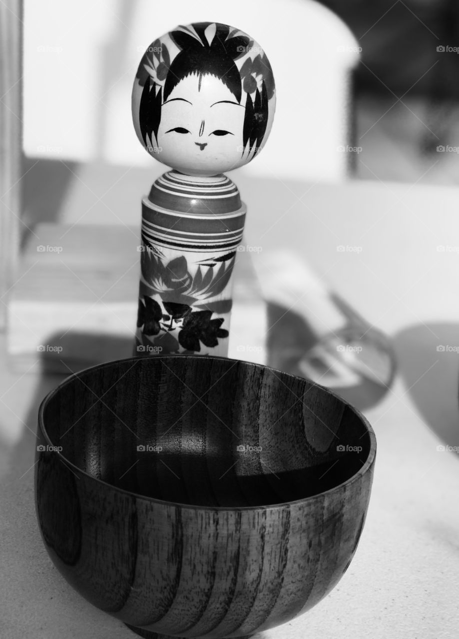 Japanese doll and bowl in black and white