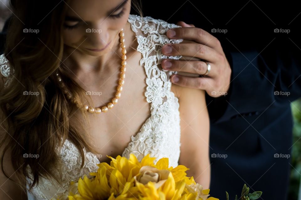 Sunflower bouquet with bride and groom