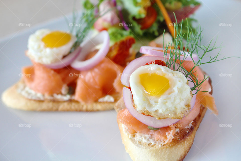 Healthy light salad. Smoked salmon tartine