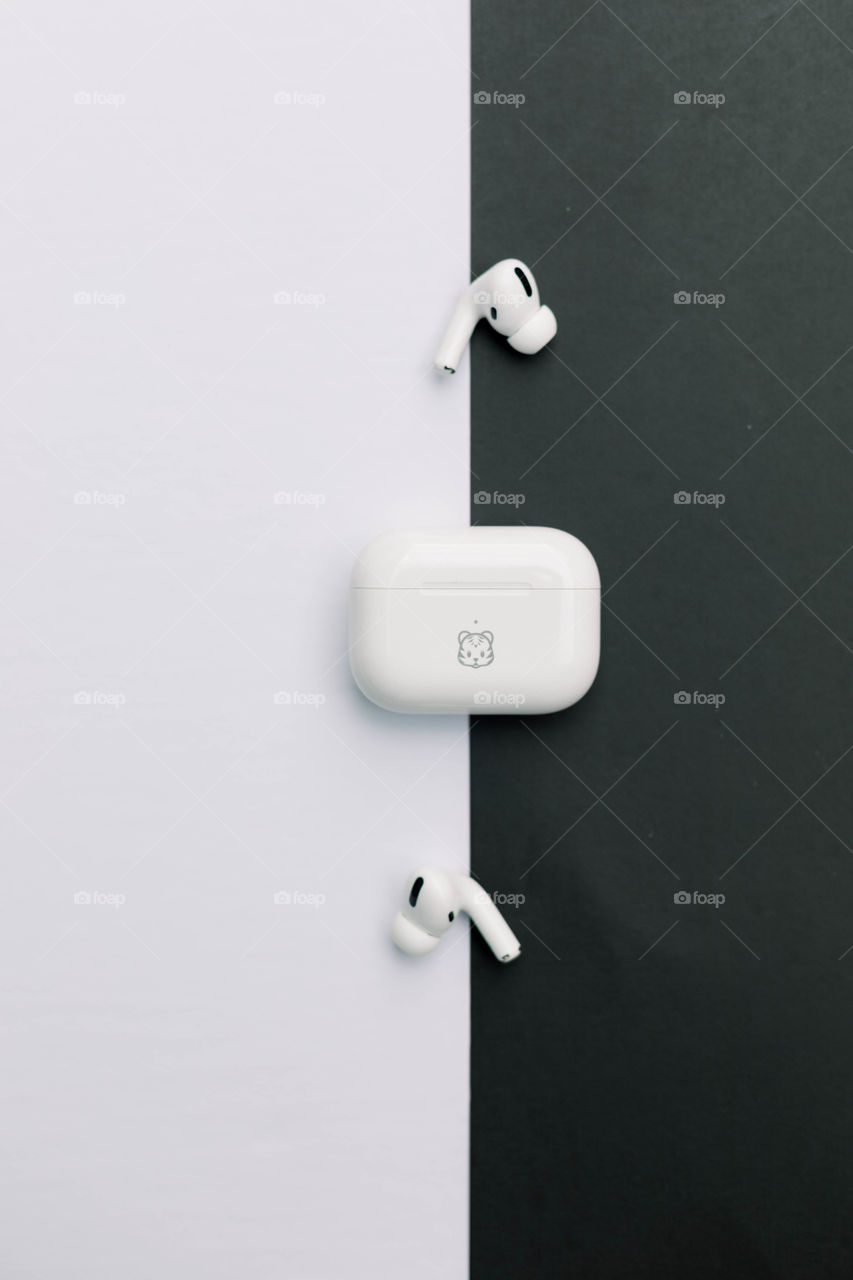 AirPods on white and black background