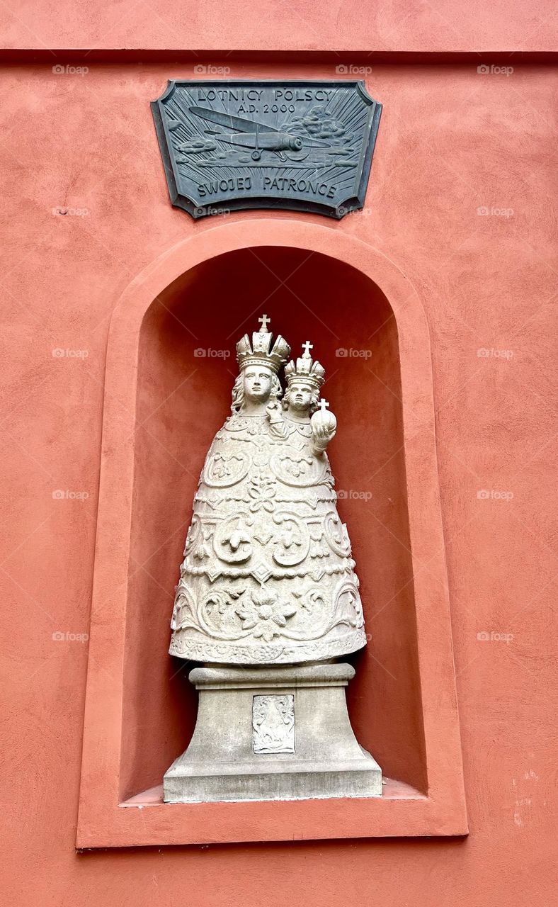 On the wall of the House of Loreto, there is a figure of Our Lady of Loterno, patroness of pilots. Krakow