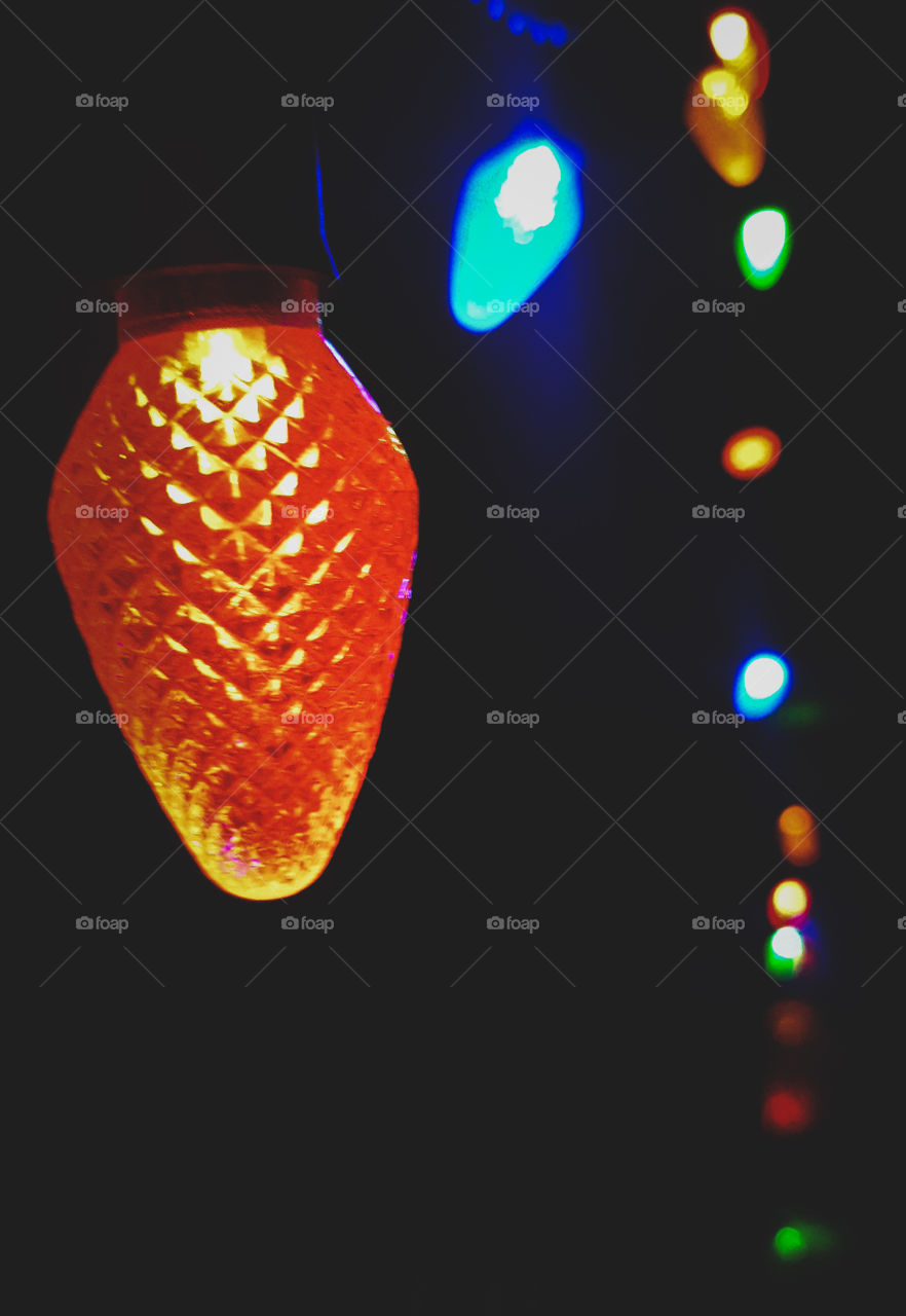 Up close photo of a string of Christmas lights.