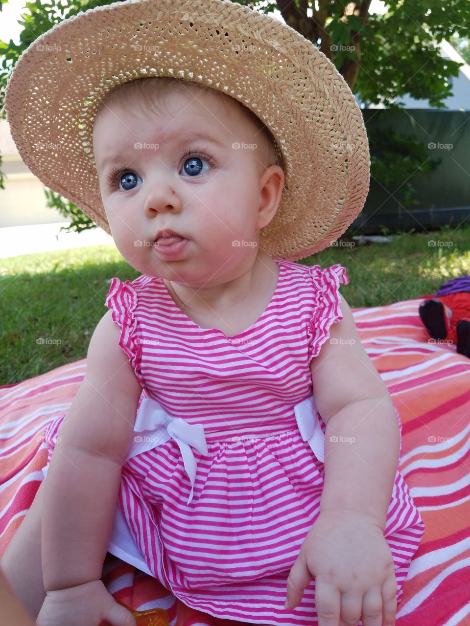 Cute girl wearing straw hat