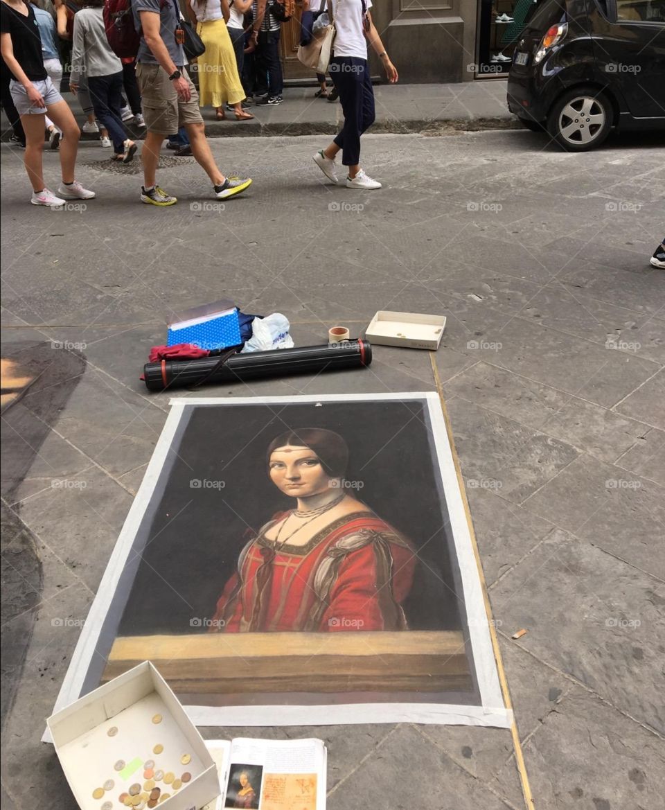 A painting dry's on the streets of italy.