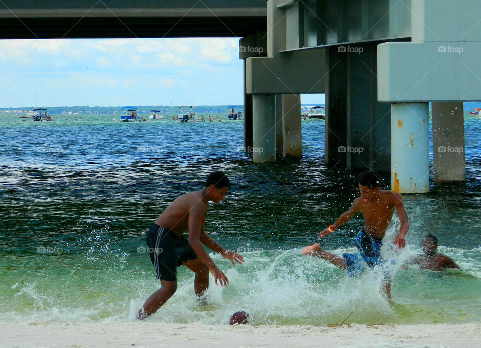 Boys playing water football