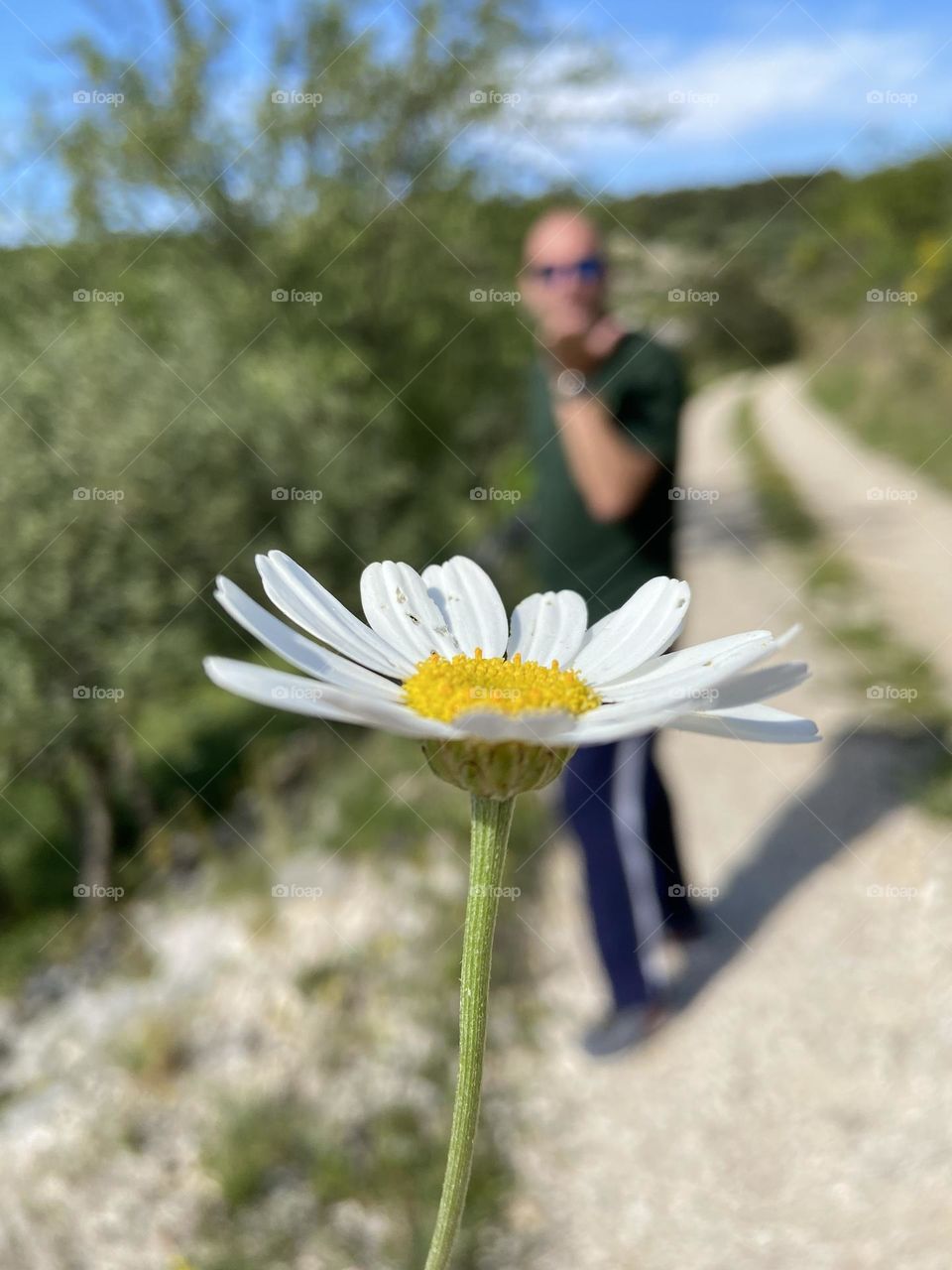 Daisy with a man blowing a kiss