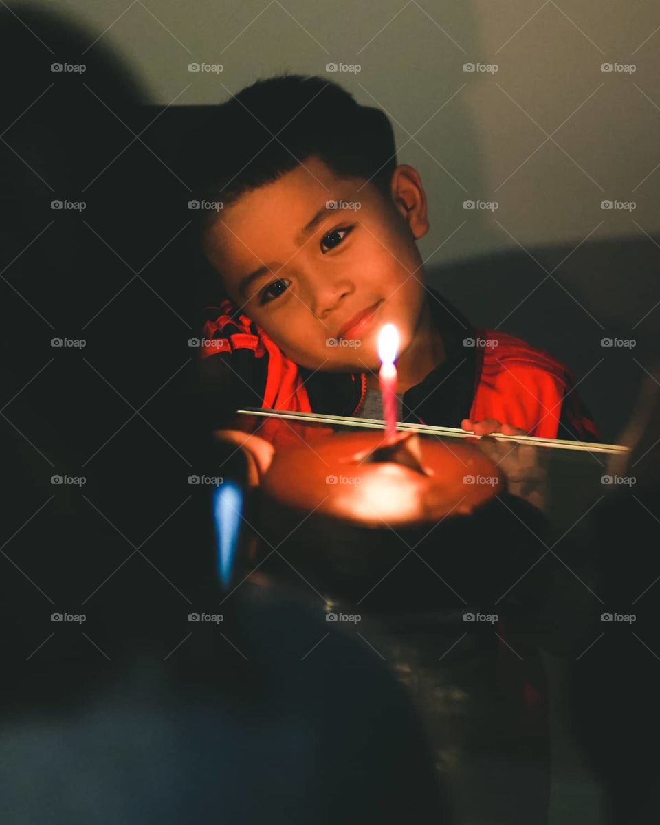 little boy enjoying his birthday cake