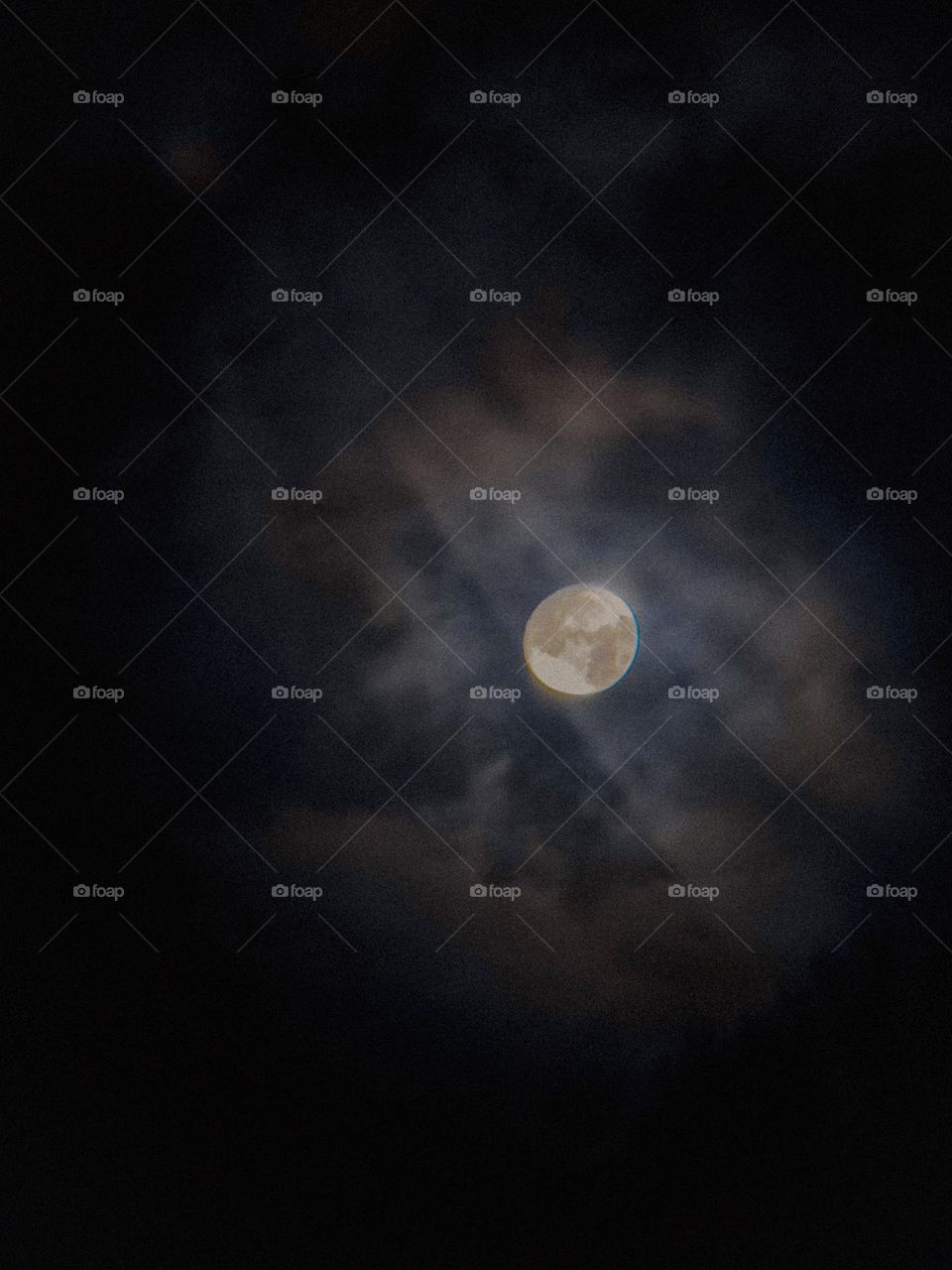 The moon covered in clouds as it gets closer to the Blue Moon this week.