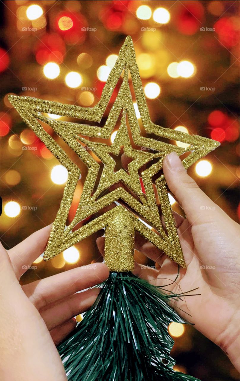 Golden star on top of the christmas tree