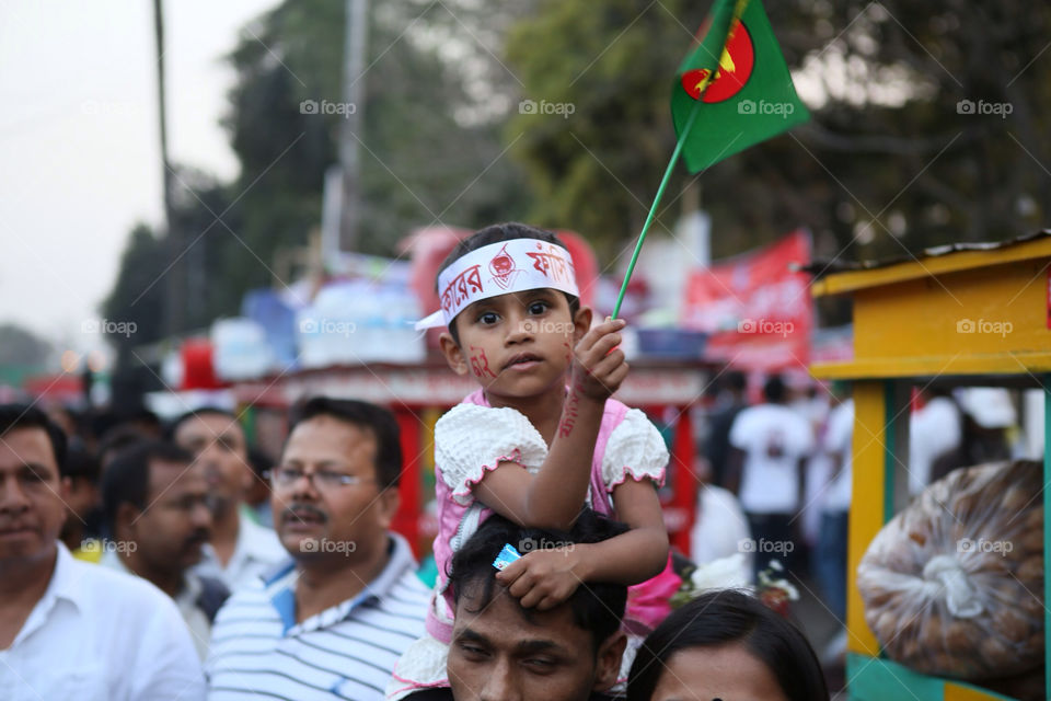 Bangladesh girl holding national flag