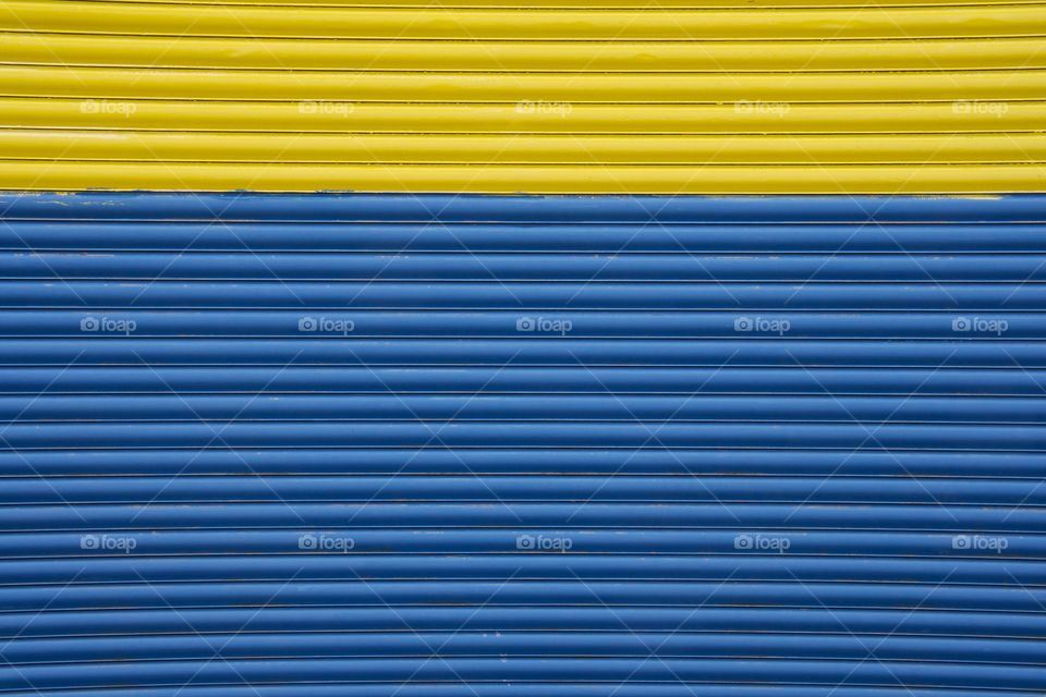 A closeup of a commercial garage door used for loading incoming and outgoing goods located
In Brooklyn, New York.