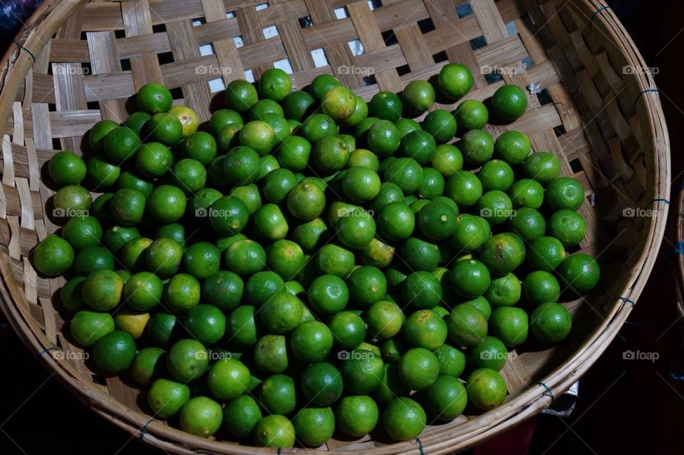 High angle view of lemon in basket