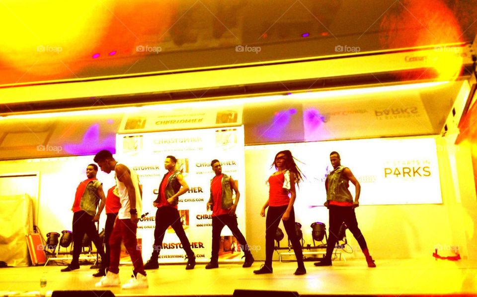 Dancers performing on stage.