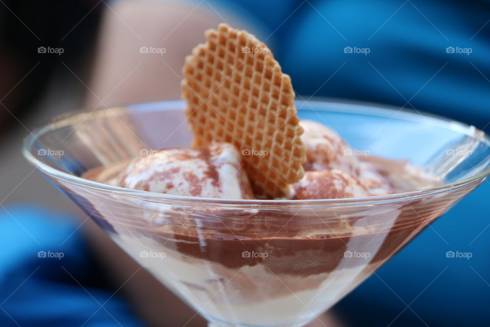 Ice cream melting fast under the summer sun 