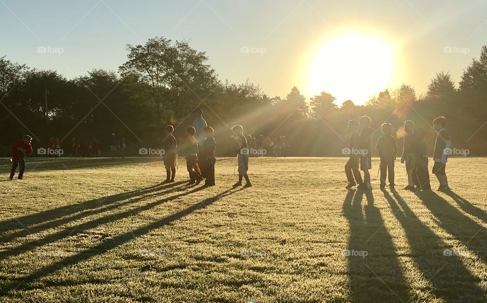 Early morning sunrise over a frost covered field at a flag football game