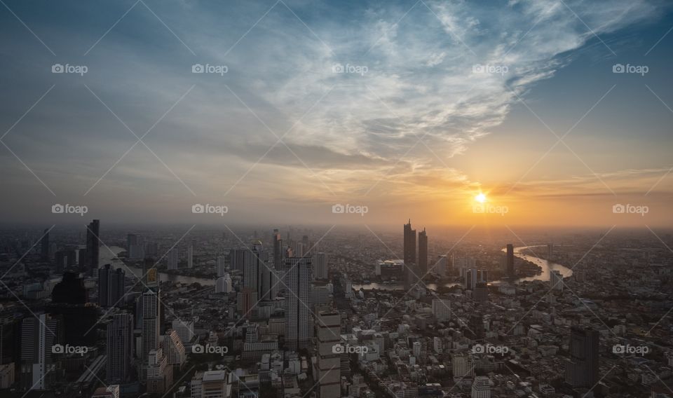 Bangkok/Thailand-May 04 2019:Beautiful summer sunset scene in capital city scape , photo from Sky roof Mahanakorn building