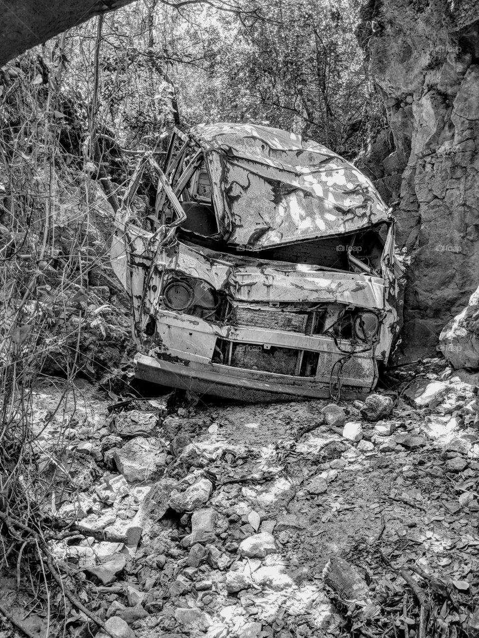Old car junkyard in a dryed river bed