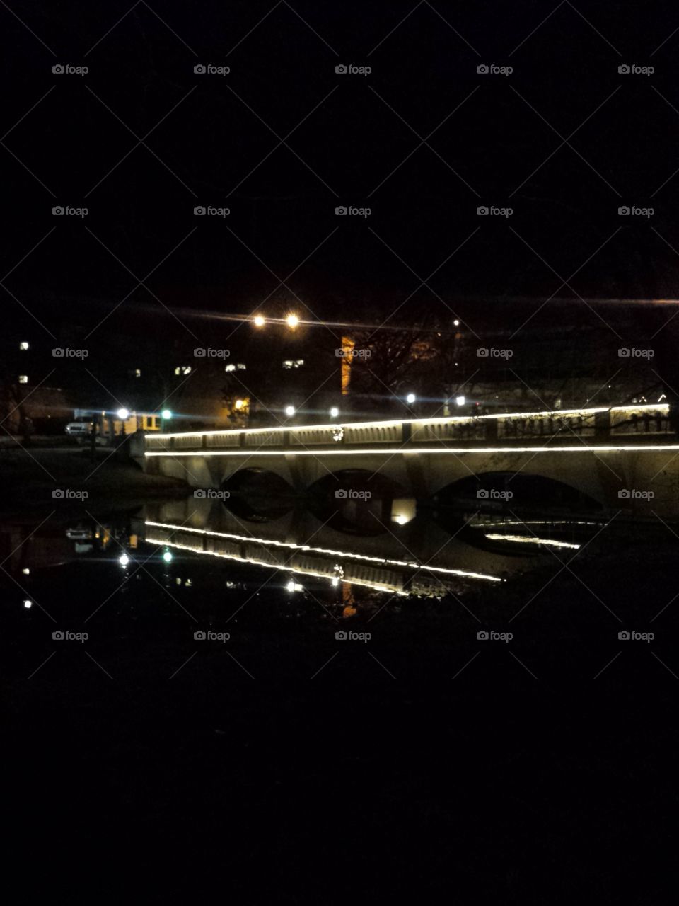 reflections of bridge at night