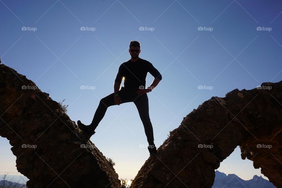 Rocks#human#silhouette#sky