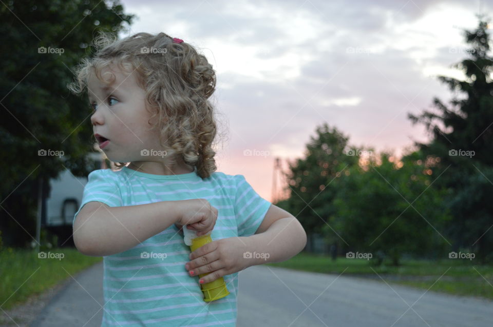 Girl trying to makes bubbles