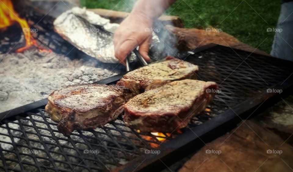 Grilled steaks over an open fire