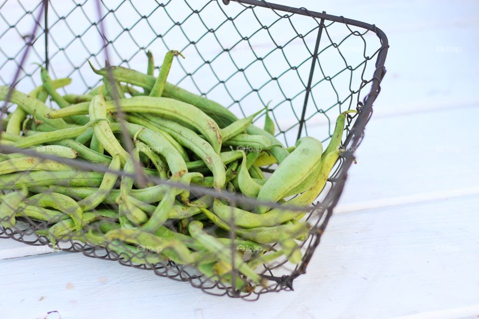 Green beans in wire basket