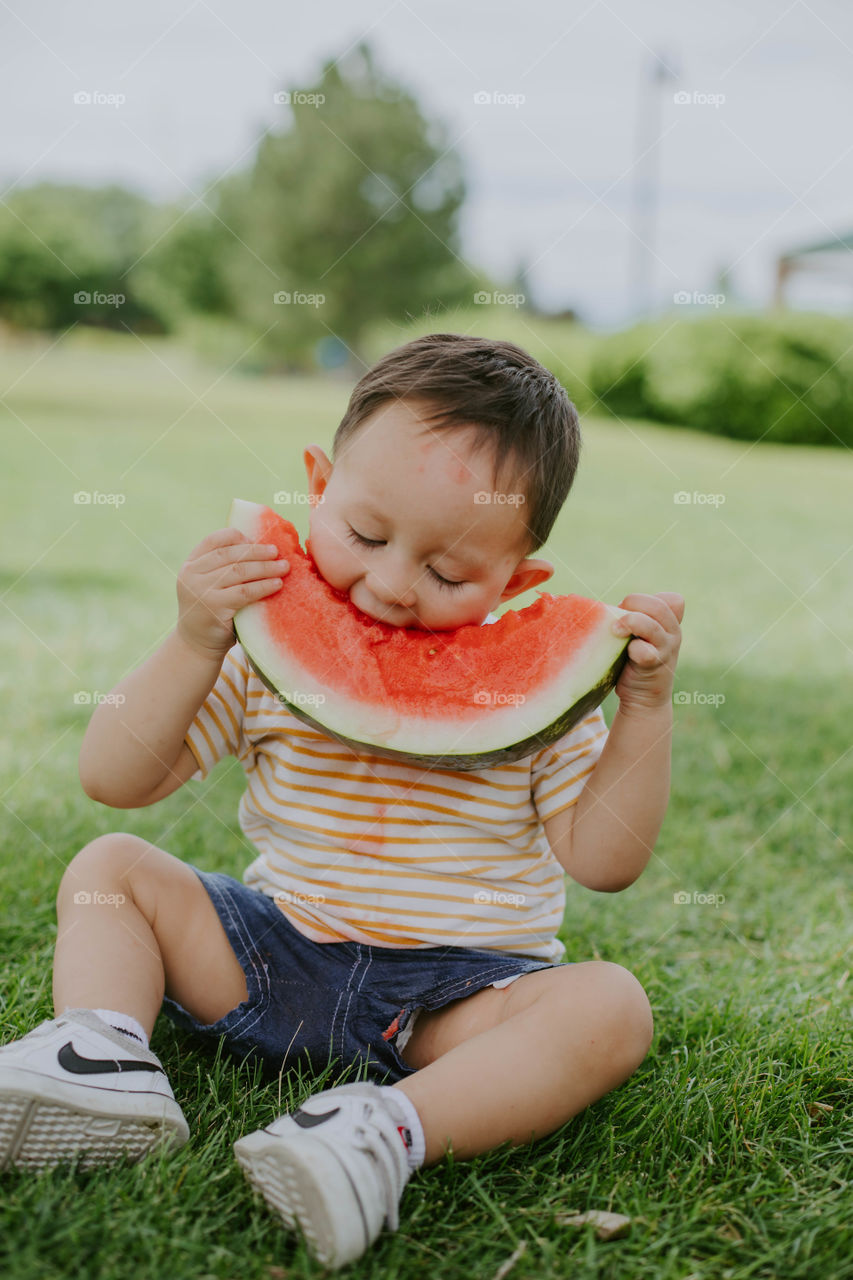 Boy eating watermelon 