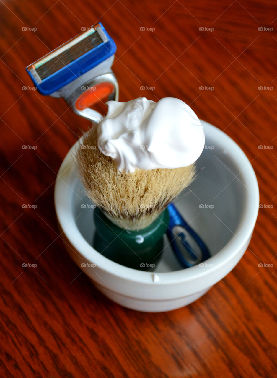 Shaving equipments on wooden table