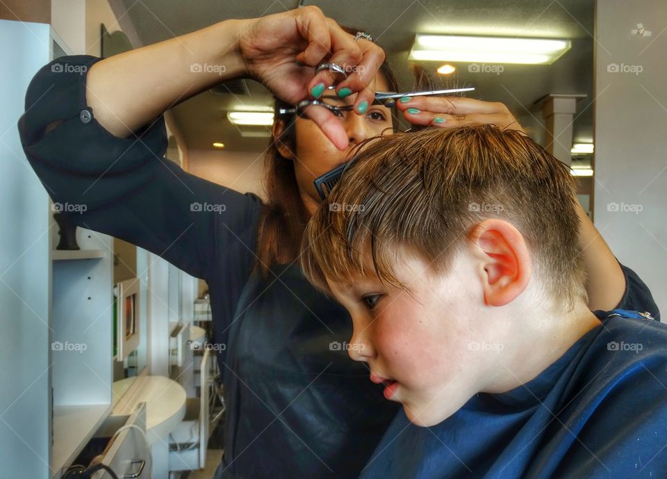 Young boy getting a haircut