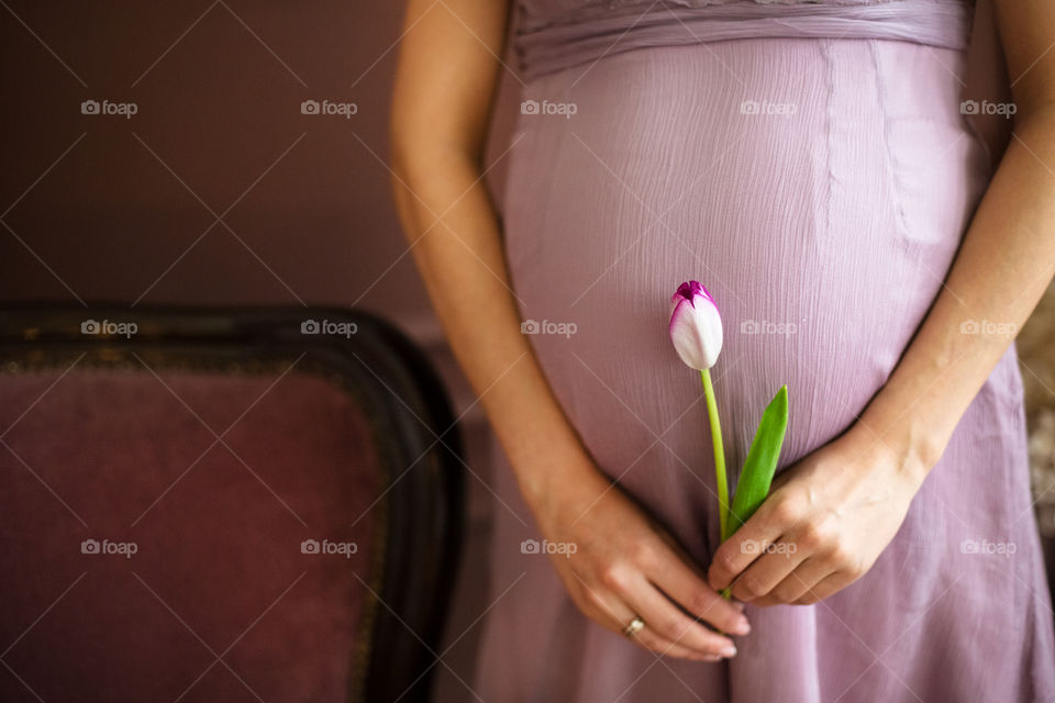 Pregnant woman with flower