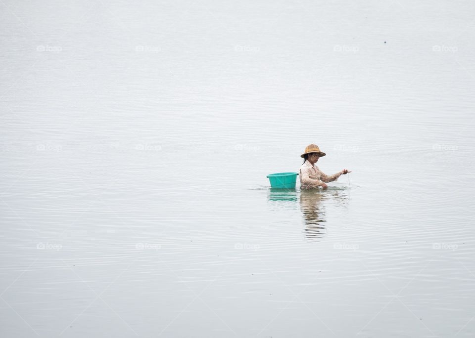 Fishermen at the longest U-Bein wooden bridge in MDL Myanmar