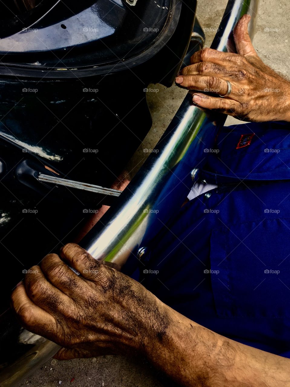 A person repairing a vehicle
