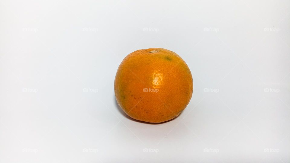 Orange fruit on white background isolated in eye level view