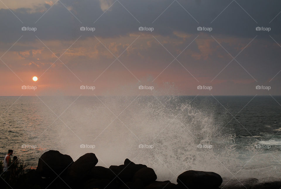 Water splashes on sunset 