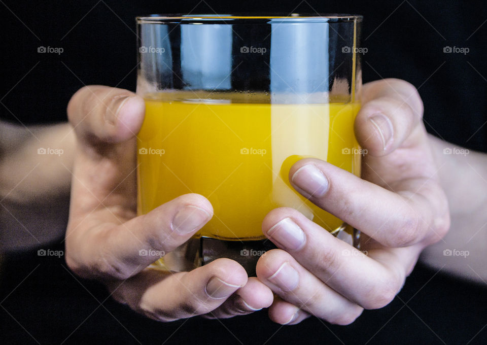 Juice and fruit in the hands of a girl