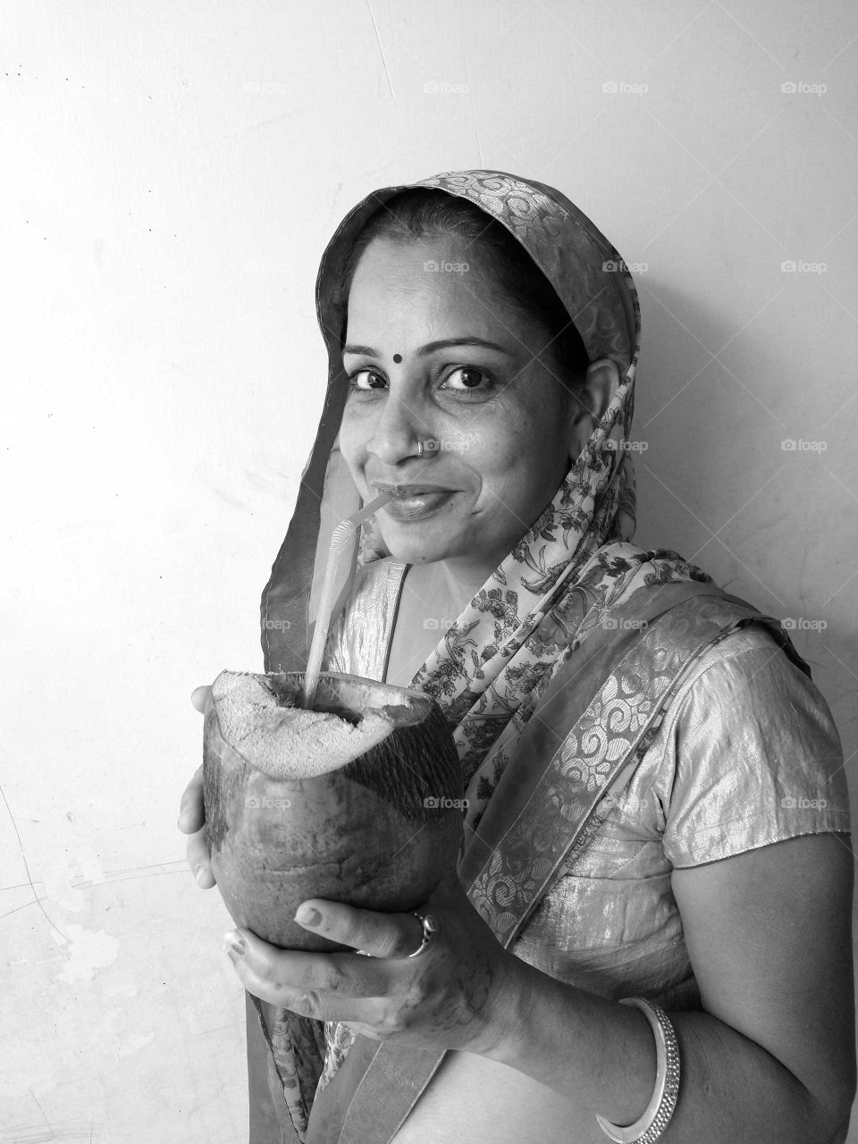 Woman drinking coconut water black and white picture