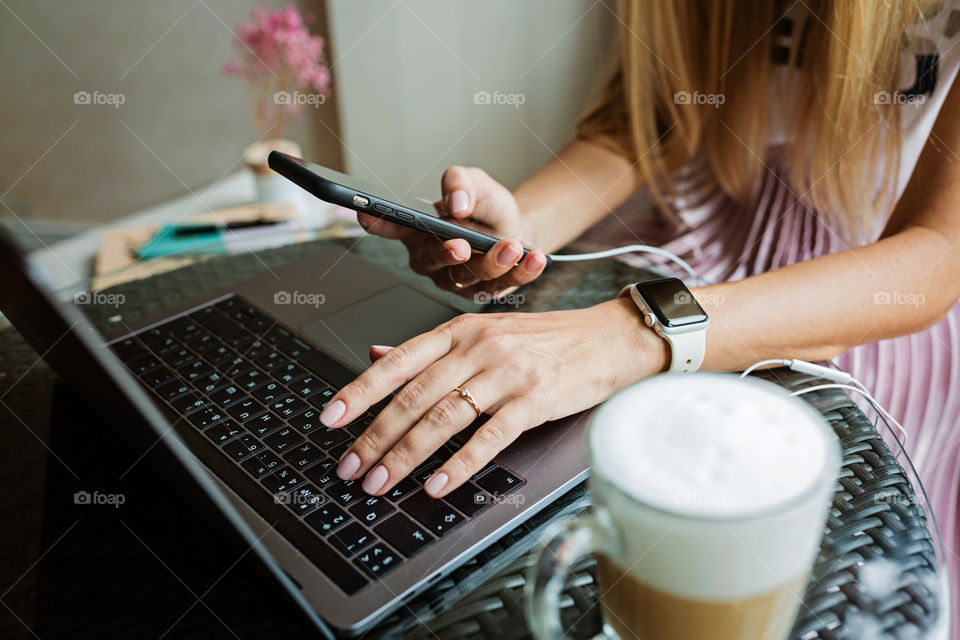 Woman’s hands typing on laptop keyboard 