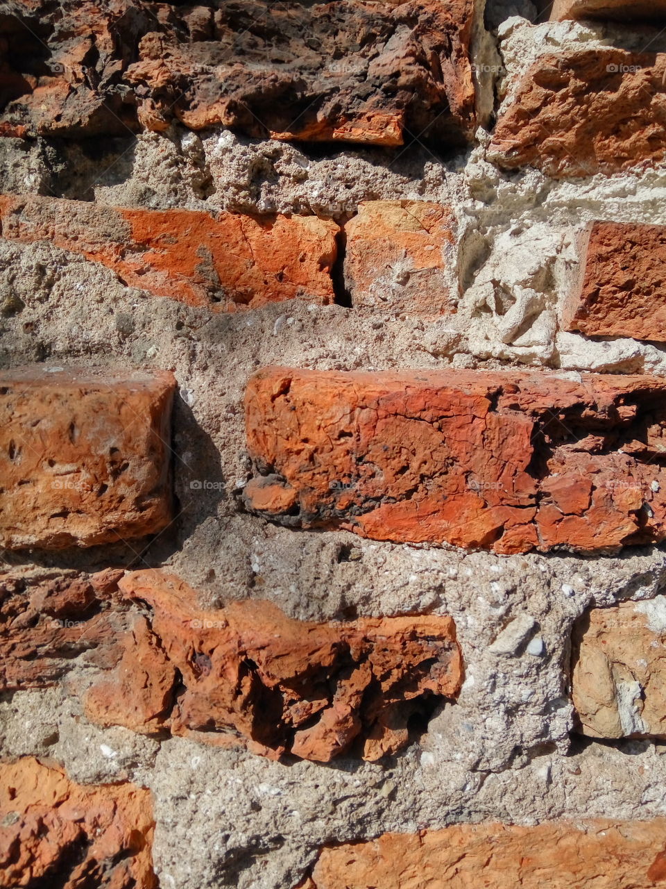 close up red brick wall and cement layers background