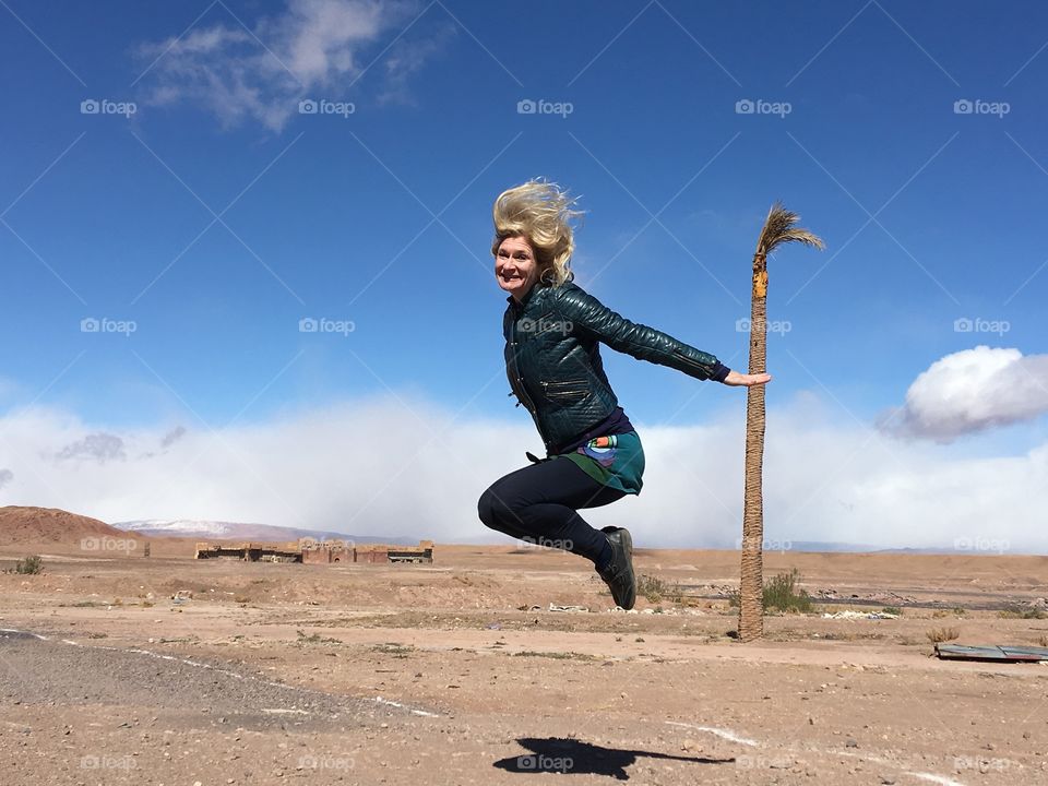 Young woman jumping in landscape
