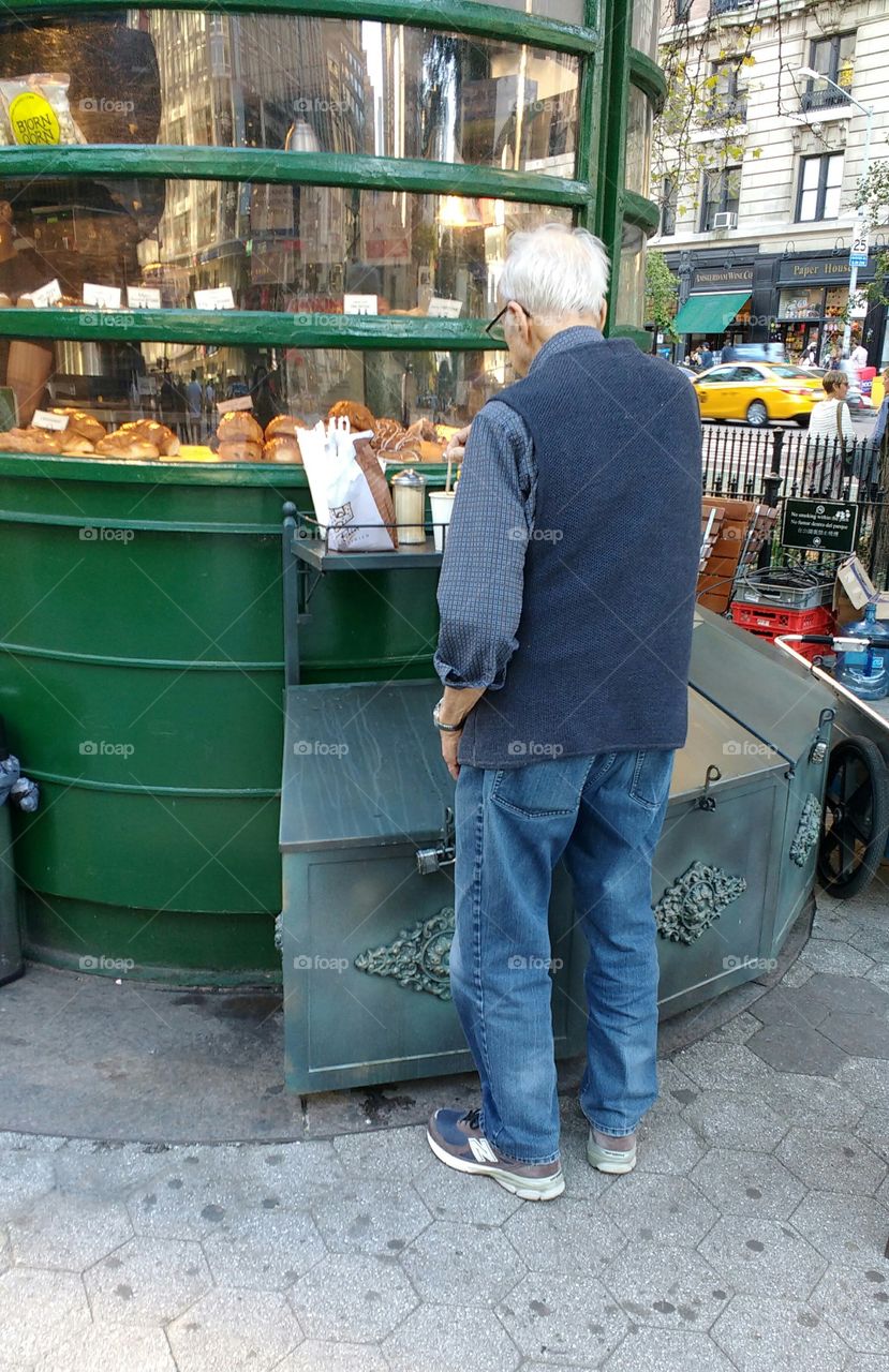 Elderly Man from Behind at an Outdoor Snack Shop