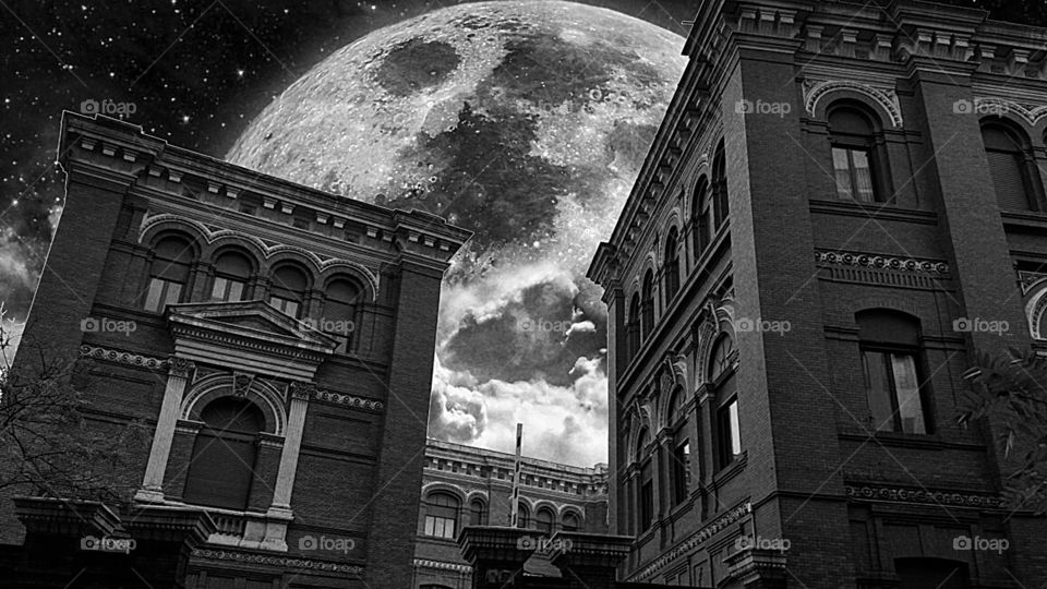 Madrid buildings with moon behind