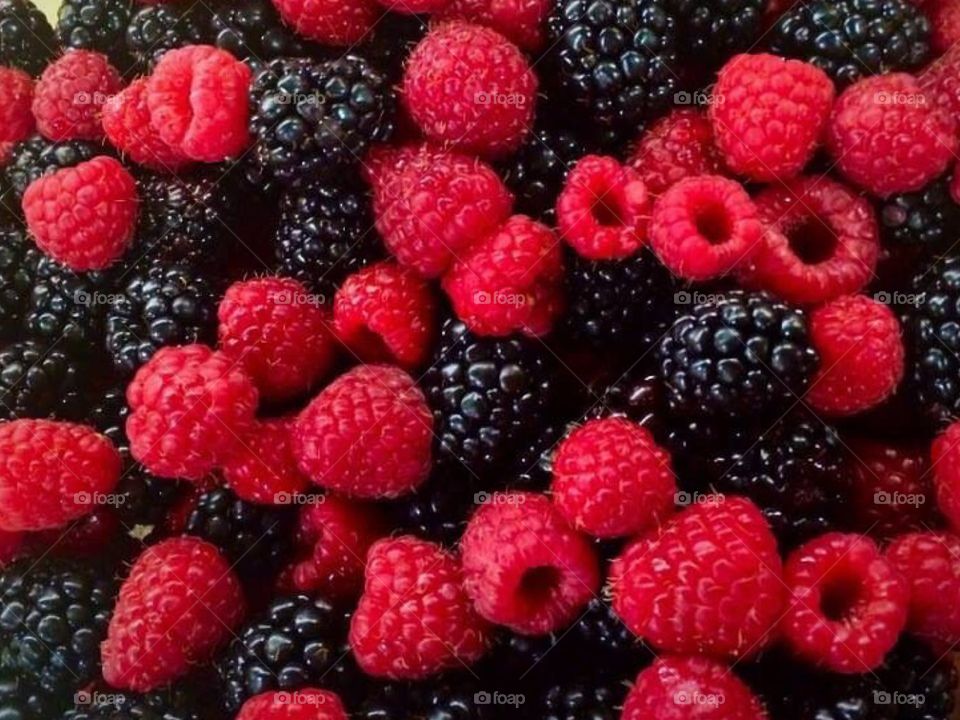 Full frame of raspberries and blackberries