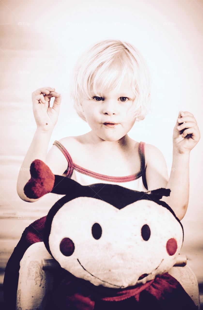 Little cute Girl with ladybug Toy swing 