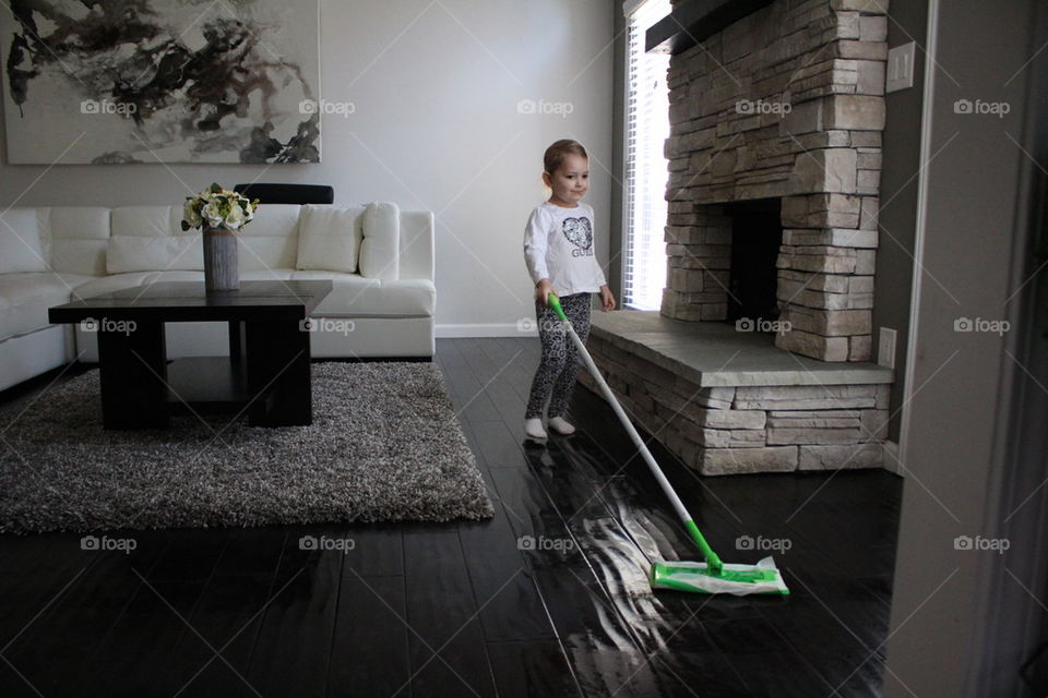 child mopping floors