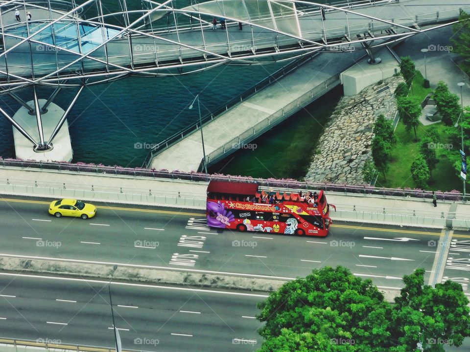 A View from Singapore Eye.
Yellow cab and red bus.