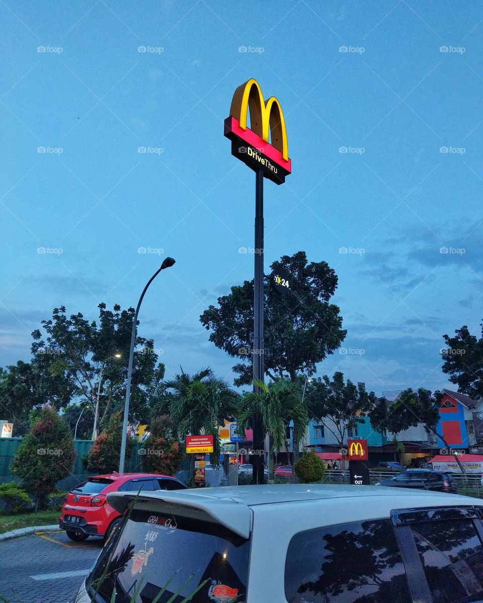 Mc Donalds sign with evening sky background