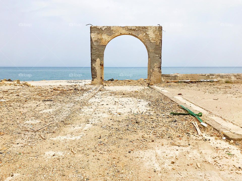 A piece of architecture on a lonely beach 