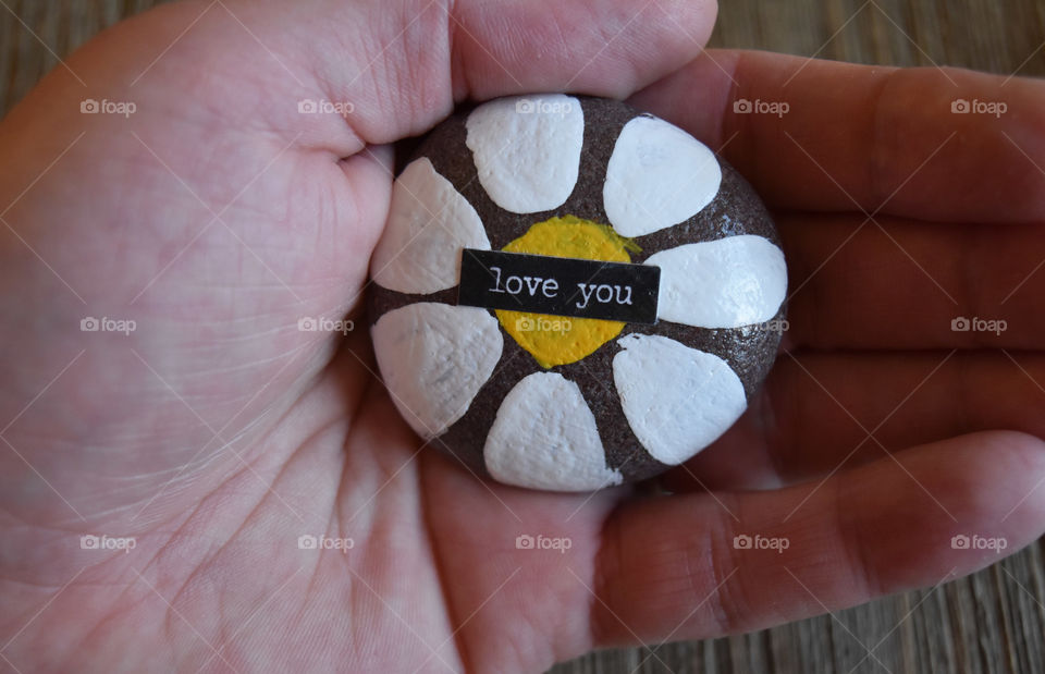 Rock painted with inspirational sentiment