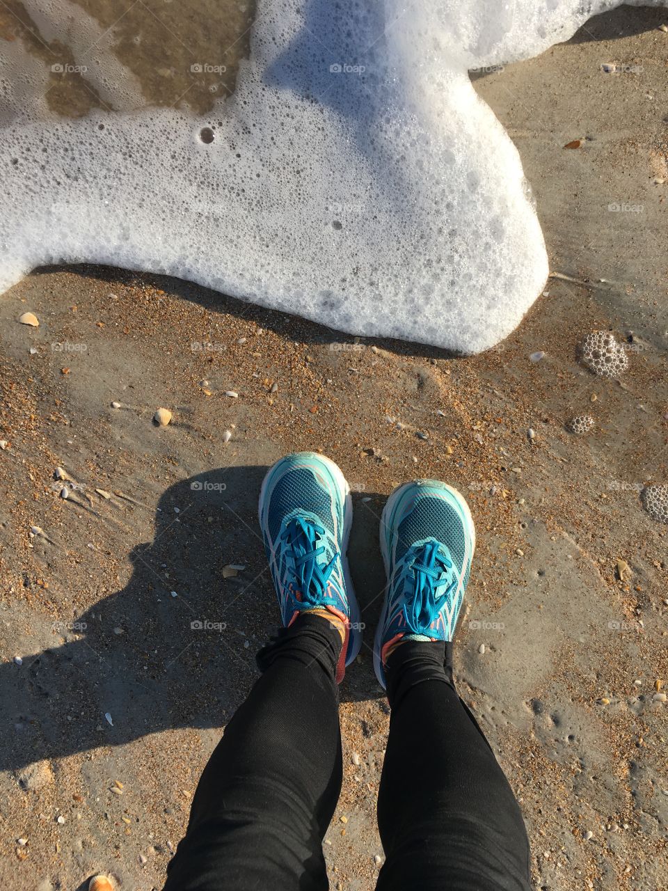 Running shoes on a beach