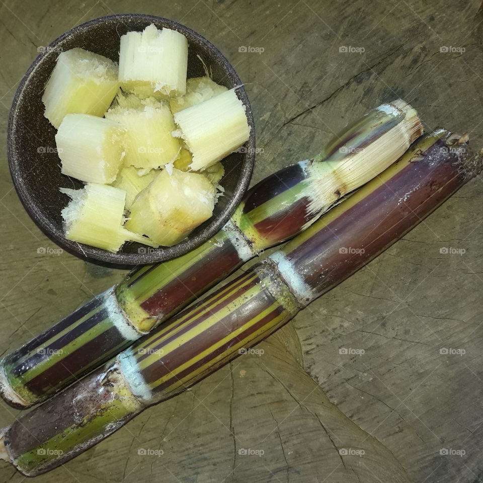 Sugarcane is a group of tall perennial grasses of the genus Saccharum, a tribe of Andropogoneae, native to the tropical regions of South Asia and Melanesia and used mainly for the production of sugar and ethanol.